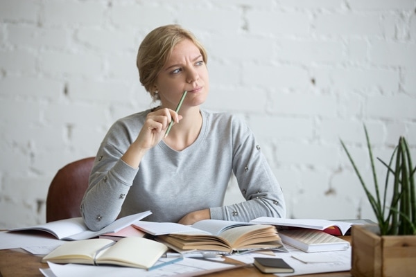 Portrait of a student woman sitting at the desk