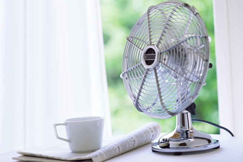 5 Ways to Improve Your Indoor Air Quality. Electric fan by window.