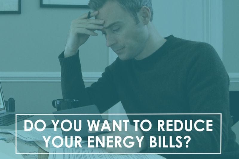 Image of someone doing paperwork. Video - Do You Want to Reduce Your Energy Bills?