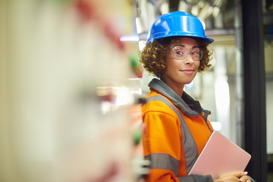 5 Questions to Ask Your HVAC Contractor. A female industrial service engineer has just conducted a safety check of a control panel in a boiler room. She is wearing hi vis